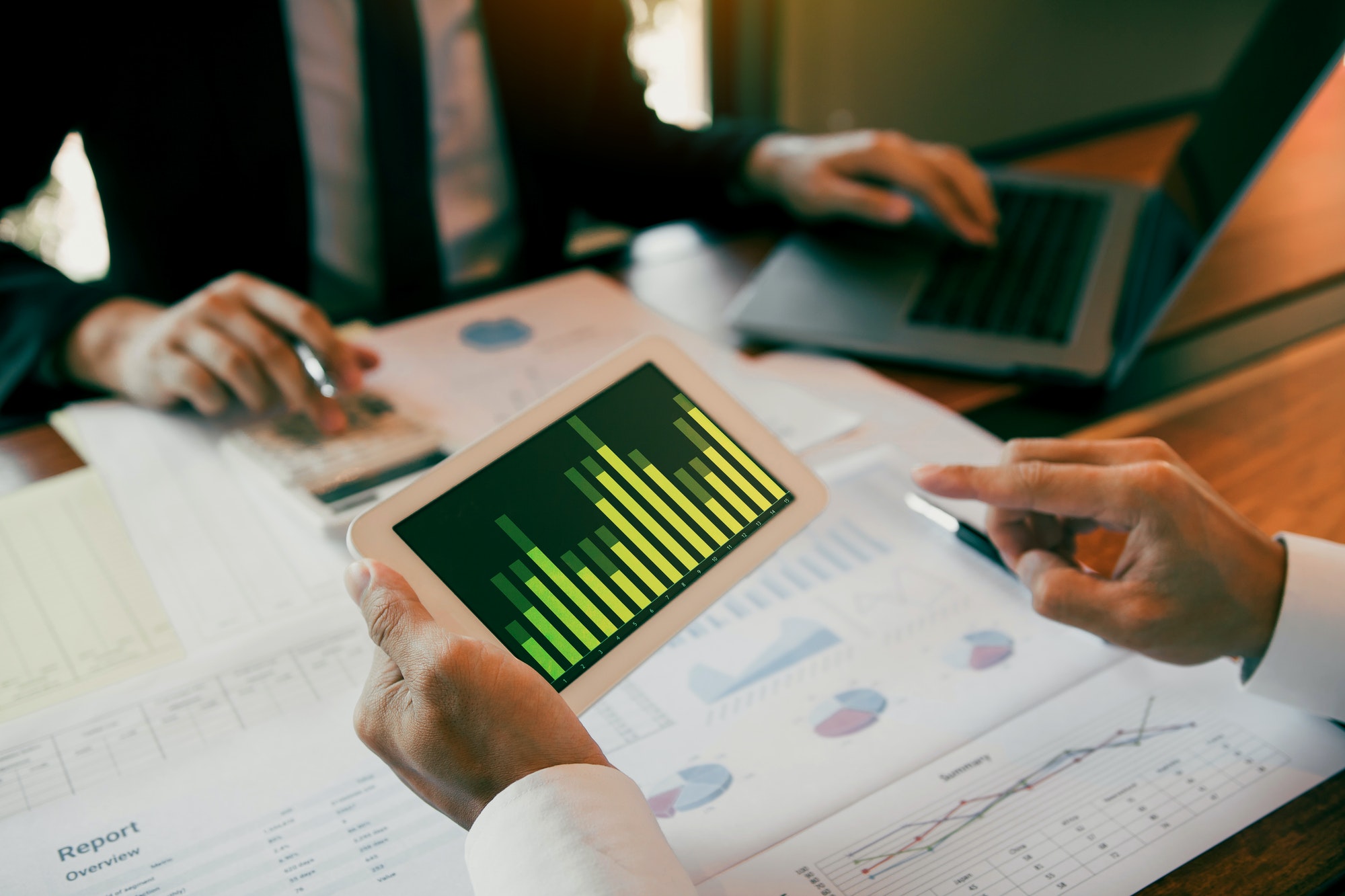 businessmen are working analyzing the company annual budget
