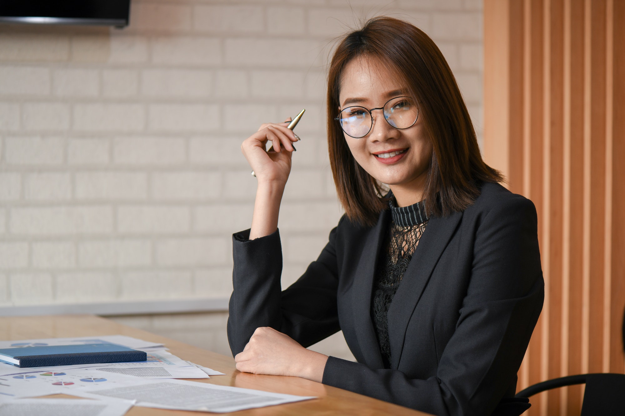 New asian female executives are working in the office.