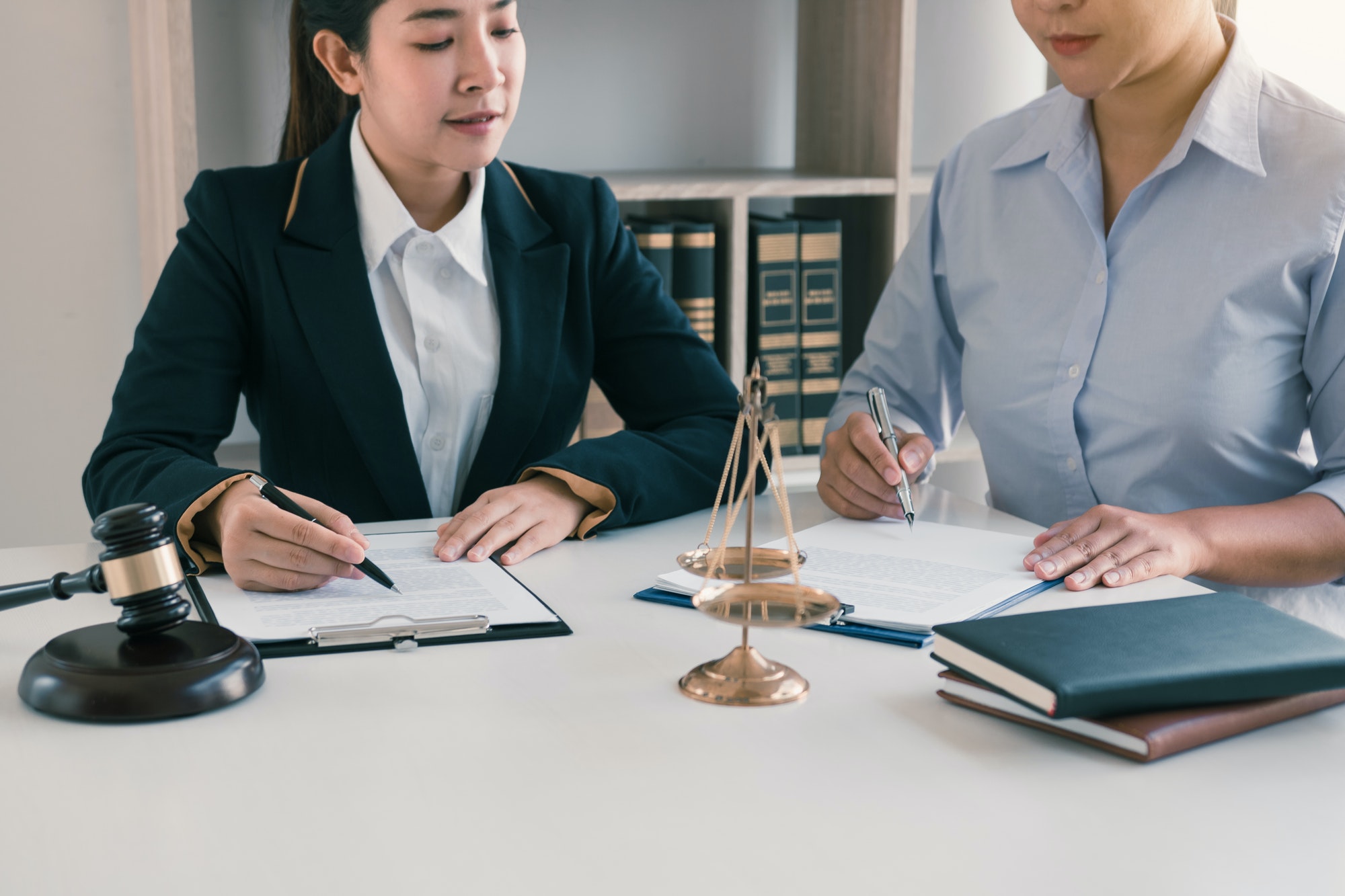 Woman judge is currently advising clients on their requests for legal proceedings and legal advice.